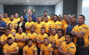 The Nauru Rugby team with their new kit presented by the vice president of the Queensland Rugby Union Garrick Morgan (Back row in suit) at the Nauru Consulate office in Brisbane. August 2019