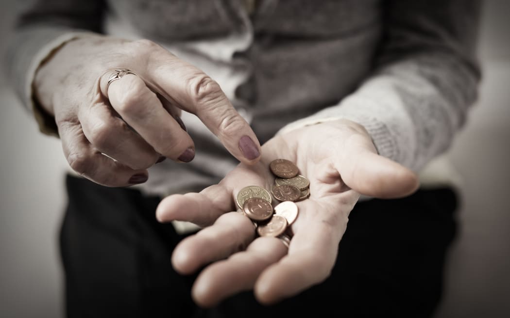 72222257 - older person counting money in her palm
