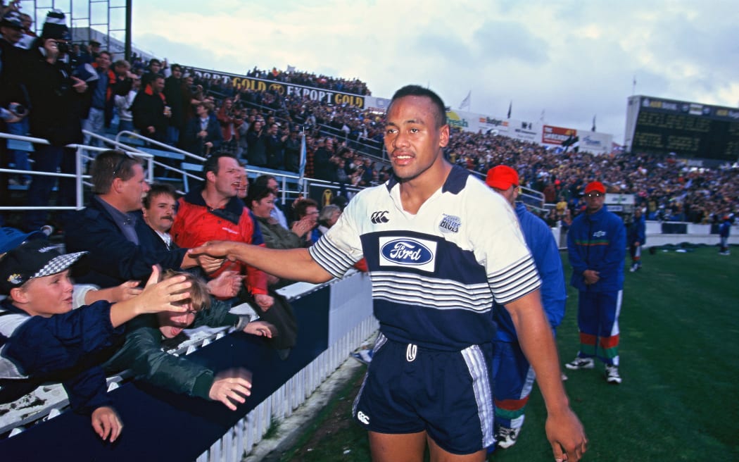 Jonah Lomu celebrates winning the Super 12 Rugby final in 1996.