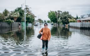Napier flood - lady walking in water
