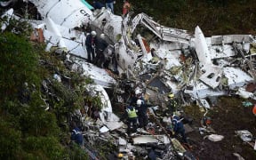 Rescuers search for survivors in the wreckage of a charter plane carrying Brazil's Chapecoense Real football team.
