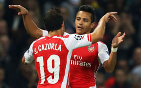 Alexis Sanchez of Arsenal celebrates scoring a goal.
