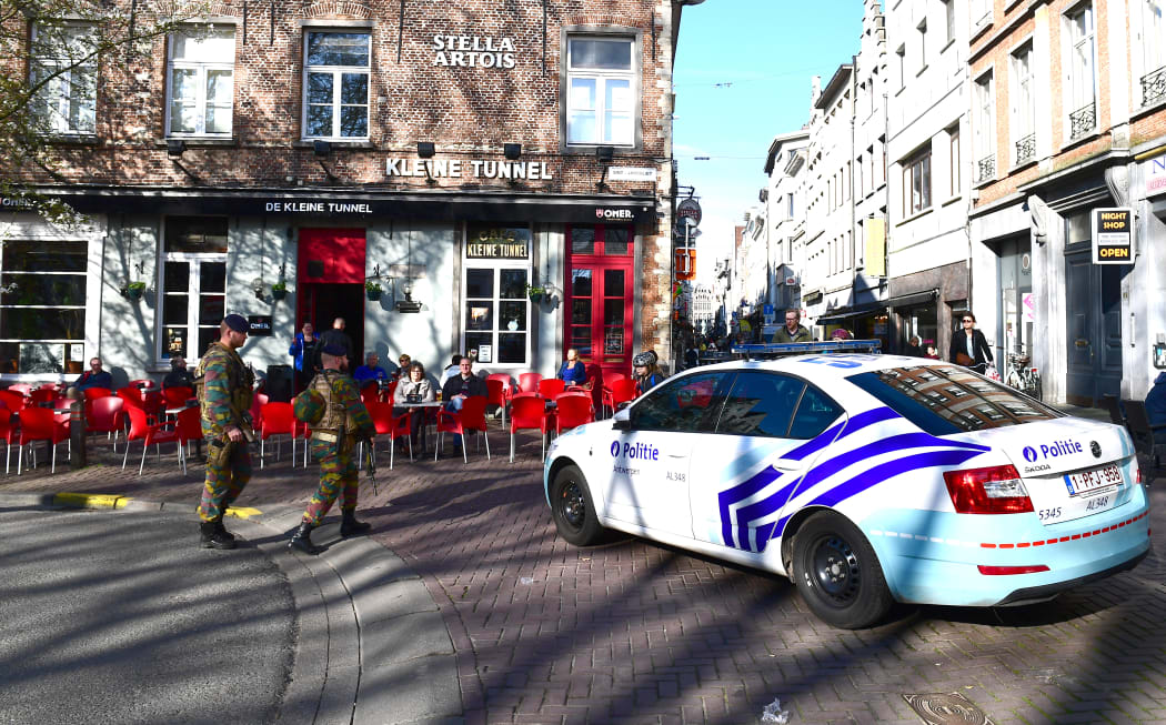 A police car blocks access to De Meir, Antwerp's main pedestrian street, after a man was arrested after he tried to drive into a crowd of shoppers at high speed on the street, on March 23, 2017, in Antwerp.