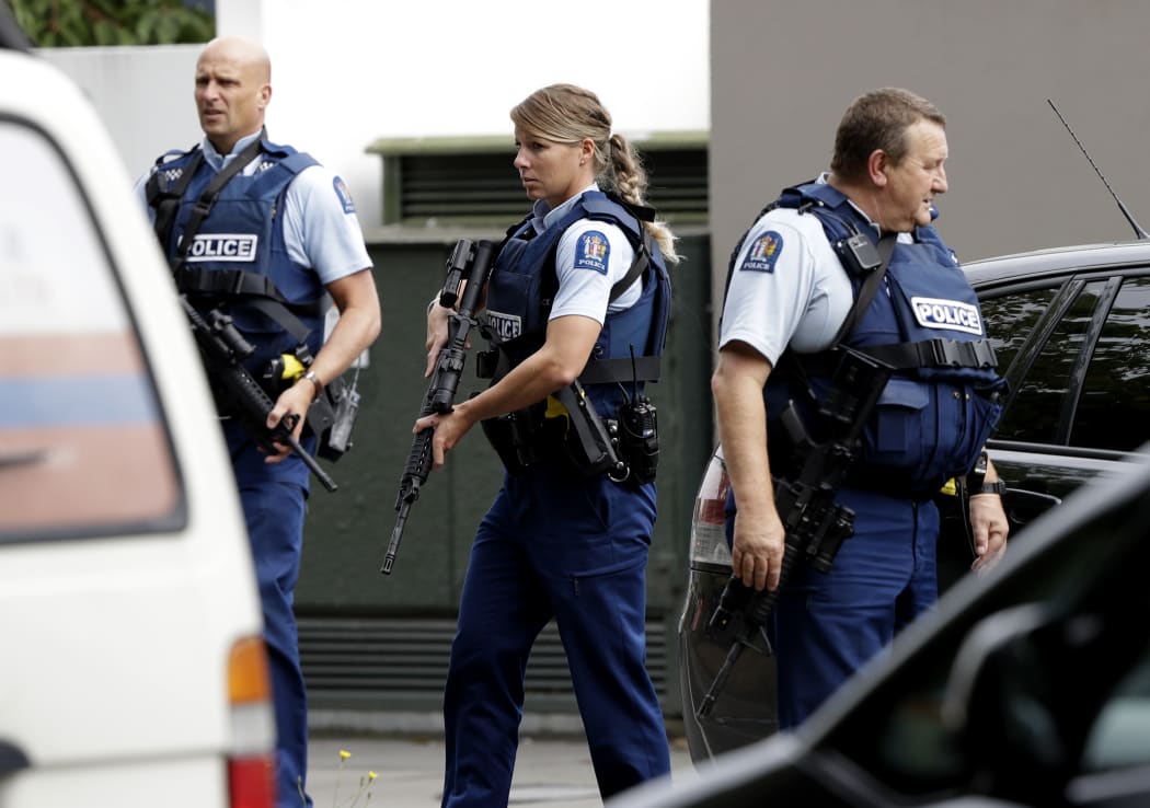 Armed police patrol outside a mosque in central Christchurch, New Zealand, Friday, March 15, 2019. A witness says many people have been killed in a mass shooting at a mosque in the New Zealand city of Christchurch. (AP Photo/Mark Baker)