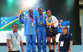 Jenlyn Wini (midle) flanked by silver medallist Lora Maelosia of the Solomons and Nauru's My-Only Stephens who claimed bronze. Photo: Team Nauru