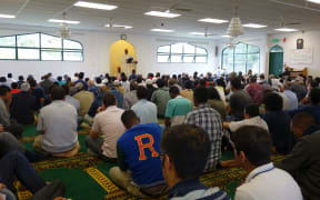 Men praying at Hamilton's Mosque during Friday prayers.