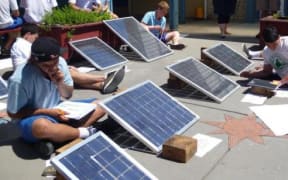 Students from Trident High Schoo testing their photo voltaic water heating systems
