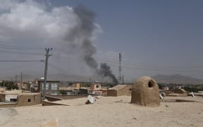 US forces launched airstrikes on August 10 to counter a major Taliban assault on an Afghan provincial capital, where terrified residents cowered in their homes amid explosions and gunfire as security forces fought to beat the insurgents back.