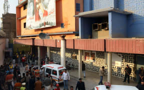 Security officials outside the Shama cinema in Peshawar after the incident.