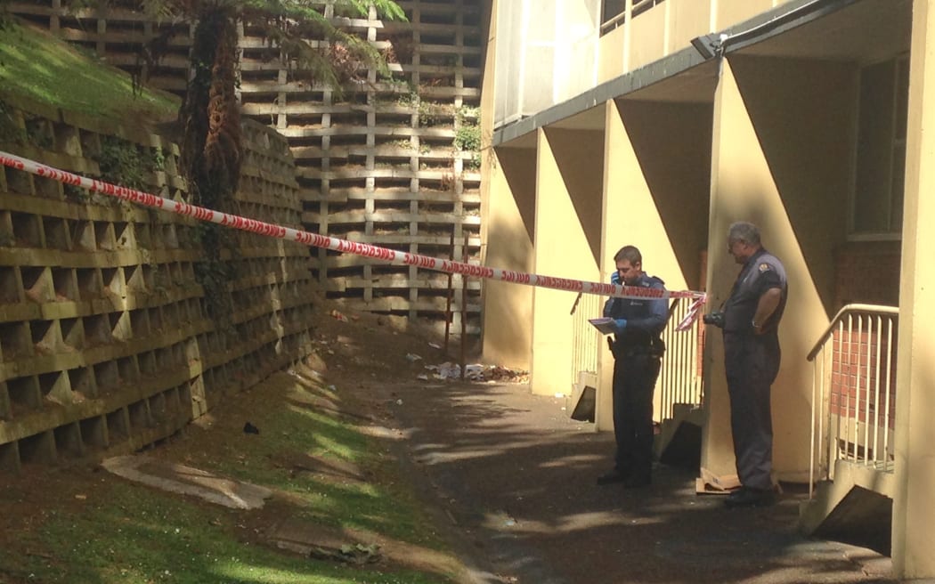 Police conduct a scene examination at the Grey's Avenue apartment block, where a man was found with critical head injuries.