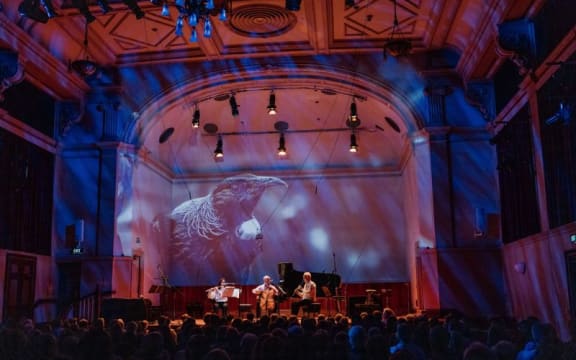 Kathryn Moorhead, Ashley Brown and Peter Scholes perform on stage of the Auckland Town Hall Concert Chamber.