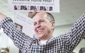 Al Jazeera journalist Peter Greste is warmly greeted by friends, family and media at Brisbane airport on February 5, 2015