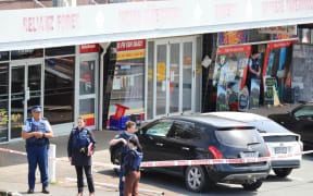 Police outside the New Windsor Dairy in Auckland following an assault on 5 October, 2023.