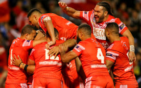 Tonga celebrate the Junior Tatola try during the Pacific Test.