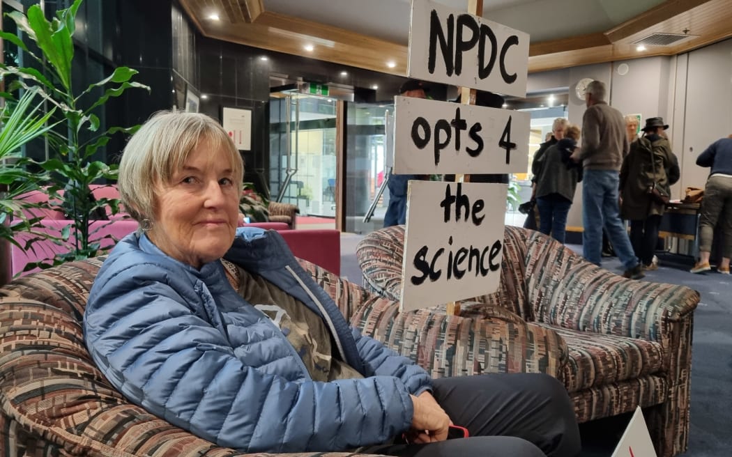 Pip Abernethy after being ejected from the New Plymouth District Council chamber after waving a pro-fluoride sign.