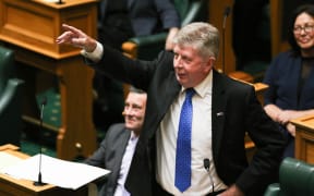National's Maurice Williamson points to his wife in the gallery during his valedictory statement to the House.