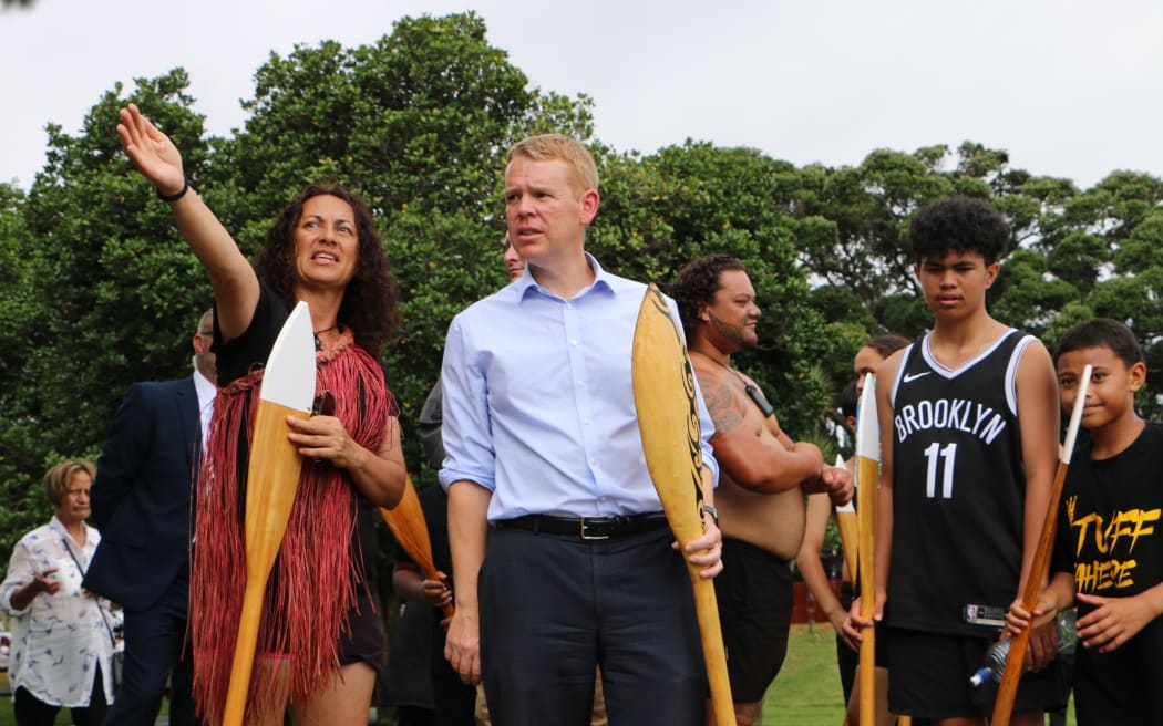 Prime Minister Chris Hipkins, who was wearing formal attire after meeting with Iwi-chairs, rolled up his suit pants to join rangatahi who were waka training at Waitangi on 3 February, 2023.