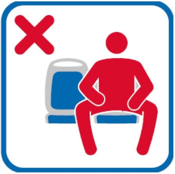 A sign on the Madrid public transport network. warning against 'el manspreading'.