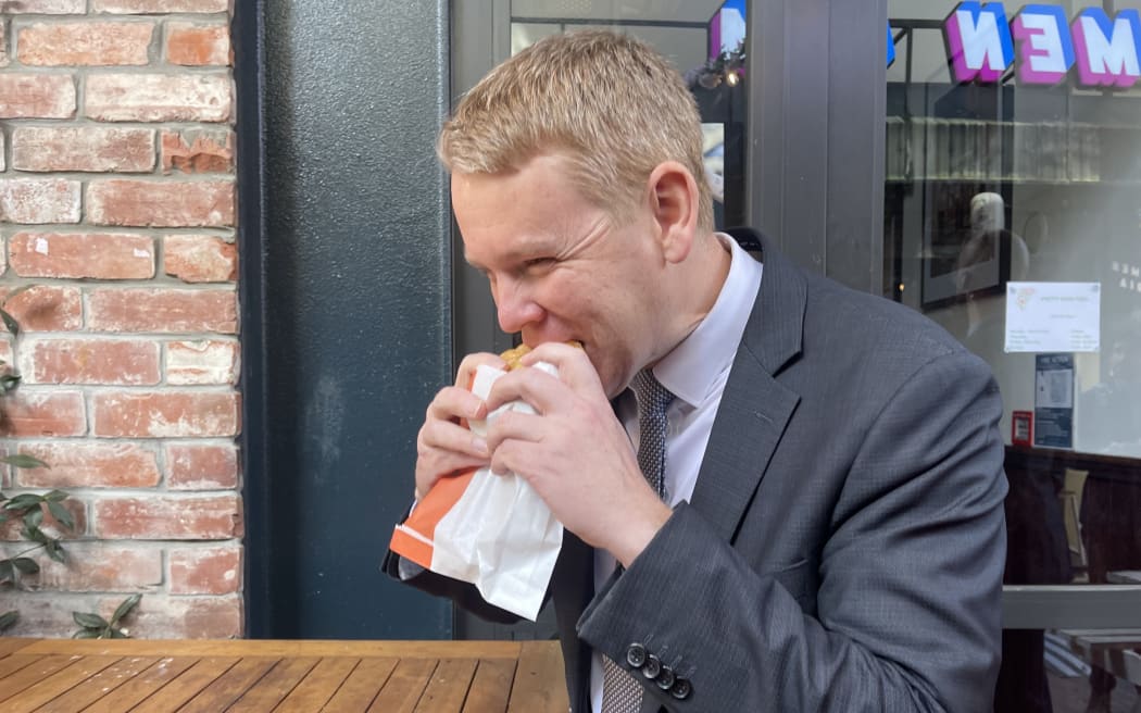 Chris Hipkins eating a steak and cheese pie for lunch while campaigning on 12 September, 2023.
