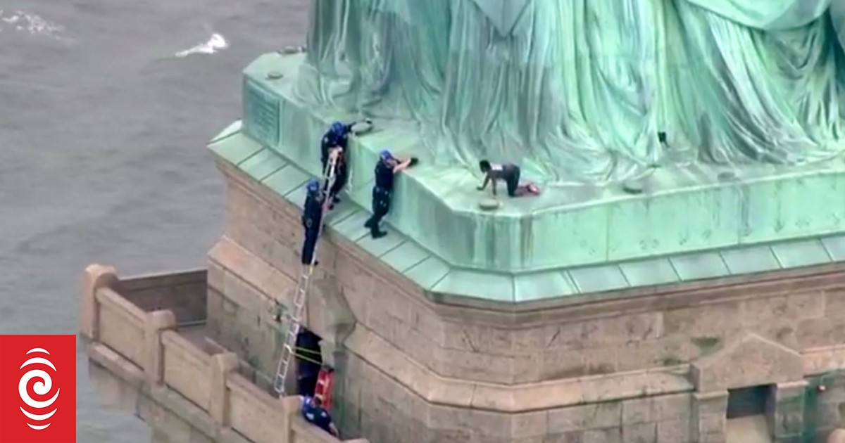 Statue of Liberty evacuated as woman climbs monument | RNZ News