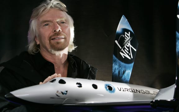 Sir Richard Branson, founder of Virgin Galactic, is pictured here with a model of the SpaceShipTwo in New York (January 2008).