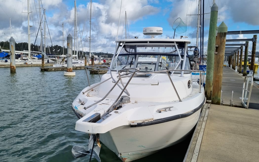 Maritime NZ officials at Port Opua boatyard assess the motorboat that crashed into a ferry in the Bay of Islands on Thursday.