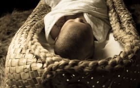 baby in flax sleeping pod