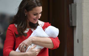 Britain's Catherine, Duchess of Cambridge aka Kate Middleton looks at her newly-born son