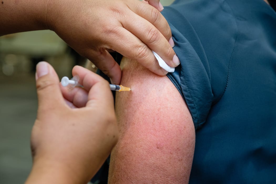 A worker on the frontline of Auckland's Jet Park Hotel quarantine facility being vaccinated against Covid-19 on 20 February 2021.