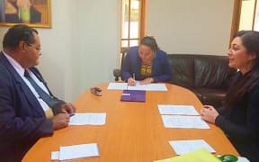 Rev Filifai'esea Lilo, HRH Princess Angelika Latufuipeka Tuku'aho and Monique Faleafa sign the agreement.