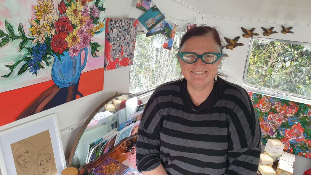 Artist Brenda Cash in her caravan studio.