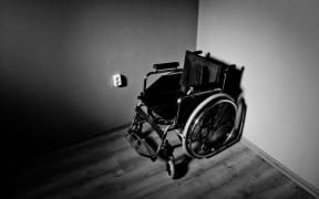 Wheelchair in a dark room