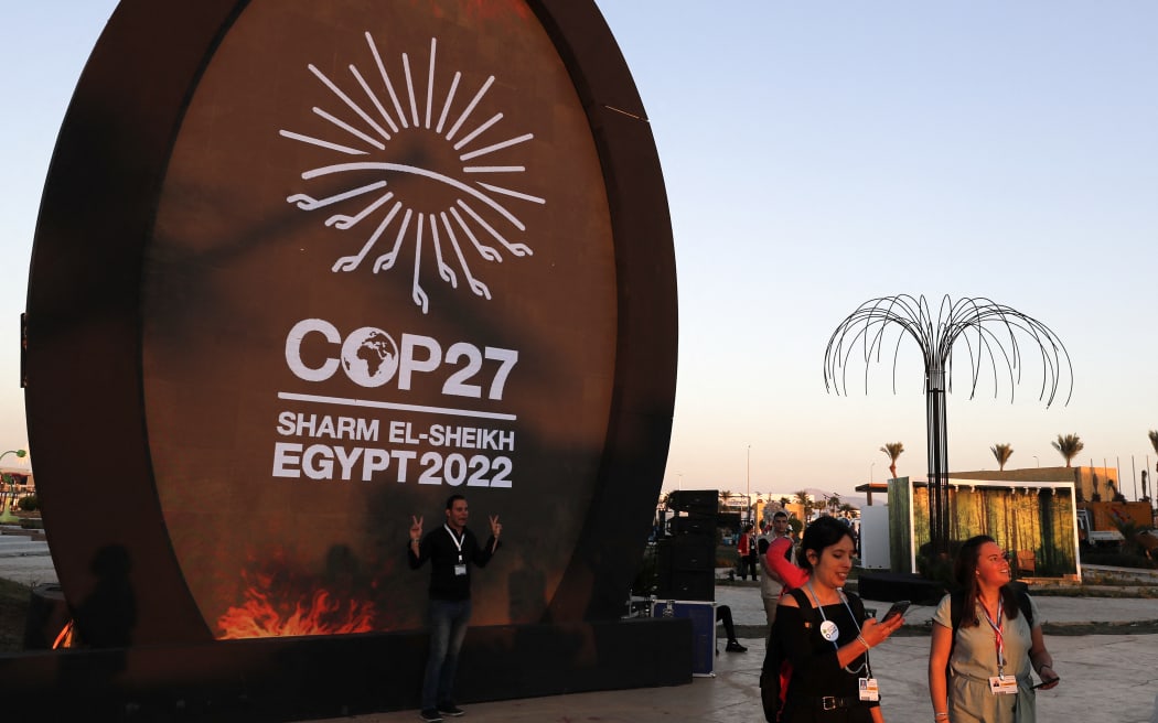 People walk at the green zone of the Sharm el-Sheikh International Convention Centre, during the COP27 climate conference in Egypt's Red Sea resort city of the same name.