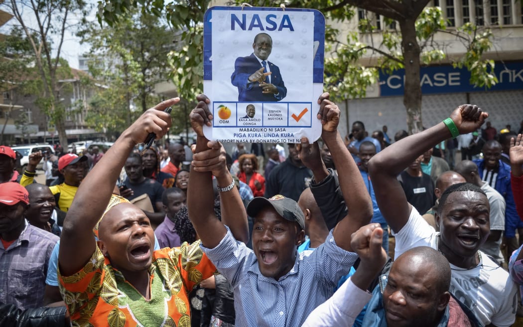 Supporters of Kenya's National Super Alliance (NASA) celebrate after the Supreme Court ordered a re-run of the 8 August presidential poll.