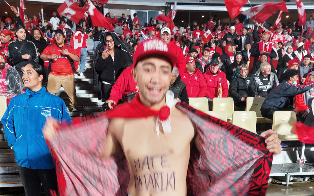 A fan shows his spirit at halftime.