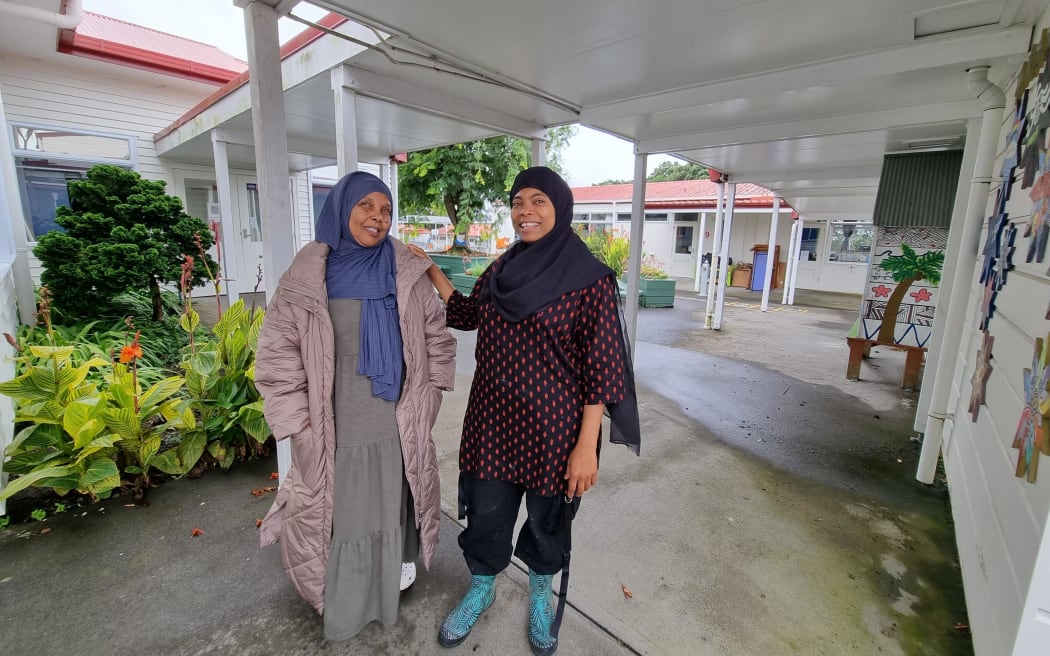 Fadumo Ahmed (left) and Asya Mohamed Abeid from the New Zealand Women's Ethnic Trust, at May Road School which has opened its doors to shelter migrants and Muslims during the Auckland floods.