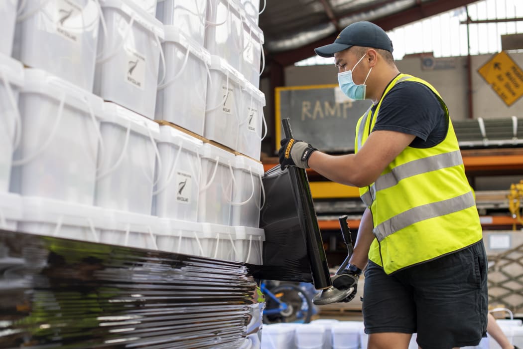 Air crew stack and secure pallets of disaster relief supplies to be sent to Tonga by Royal New Zealand Air Force, in the wake of a tsunami triggered by a volcanic eruption in January.