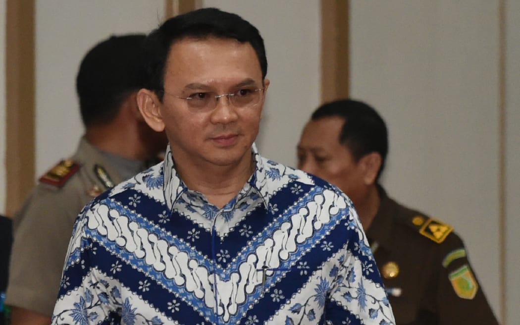Jakarta's Christian governor Basuki Tjahaja Purnama, popularly known as Ahok, arrives at a courtroom for his verdict and sentence in his blasphemy trial in Jakarta today.