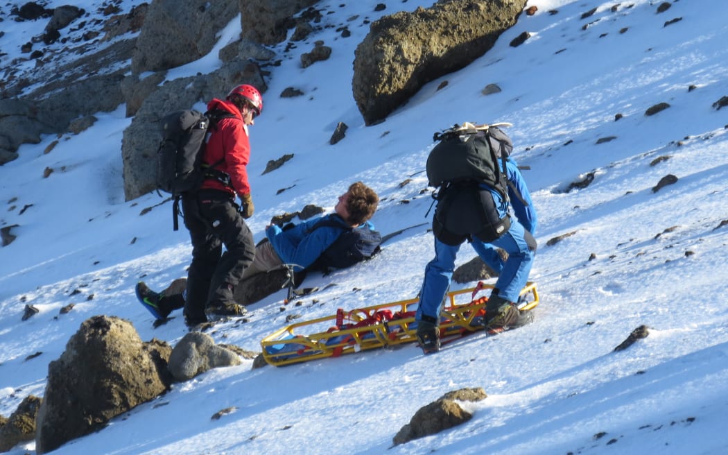 A rescue team prepares to lift a German backpacker off Mt Tongariro.