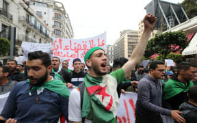 Algerian students demonstrate with national flags in the center of the capital, Algiers in Algeria on March 26, 2019, against the extension of the mandate of President Abdelaziz Bouteflika and demanding an immediate change.