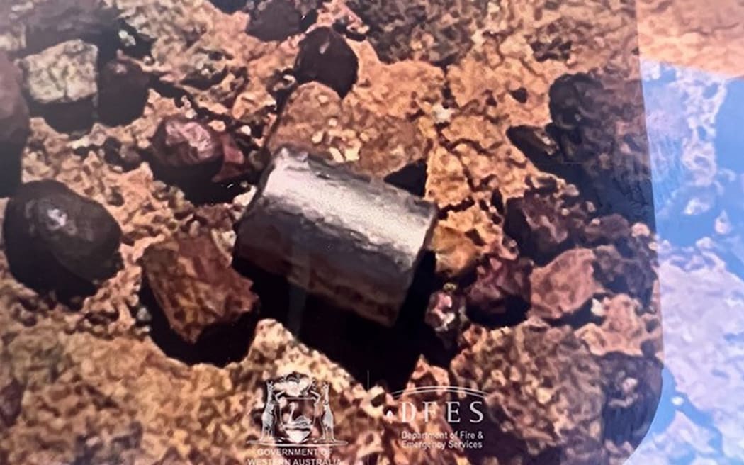 This handout from the Government of Western Australia's Department of Fire and Emergency Services taken and received on February 1, 2023 shows a radioactive capsule, which had fallen off a truck, after it was found along a desert highway south of Newman, Western Australia. - A tiny but dangerously radioactive capsule, which fell off a truck along a remote stretch of Outback highway in Western Australia last month, was found on February 1, authorities said. (Photo by Handout / various sources / AFP) / -----EDITORS NOTE --- RESTRICTED TO EDITORIAL USE - MANDATORY CREDIT 