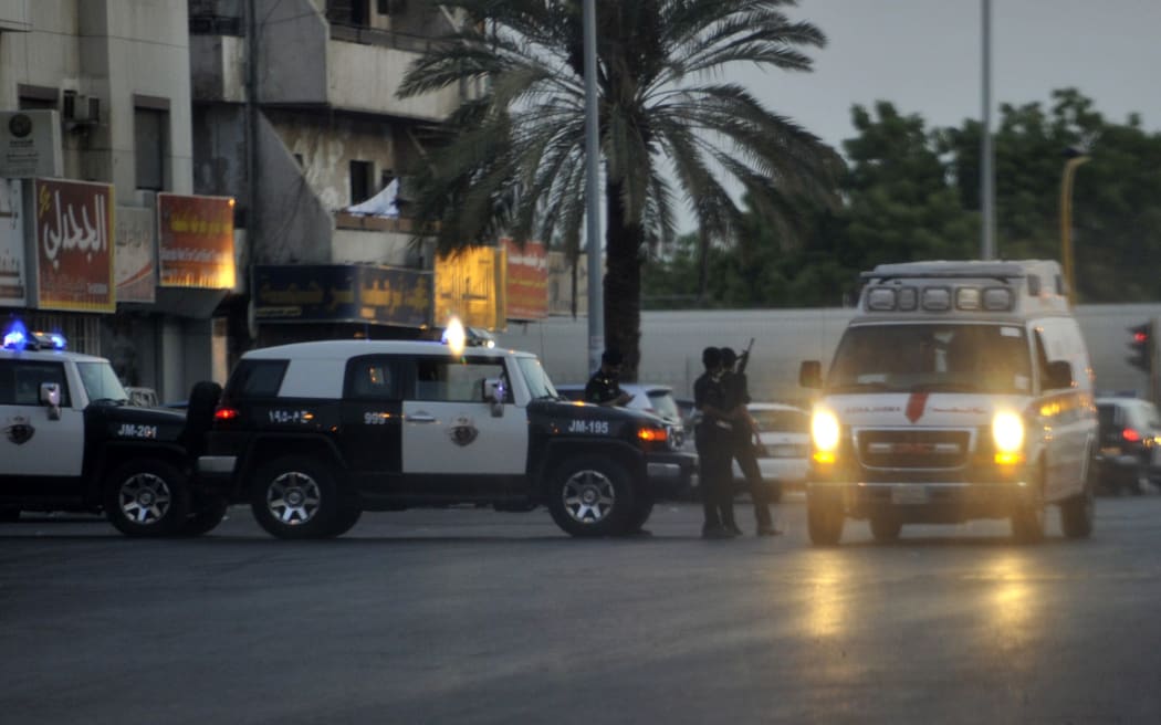 Saudi police stand guard at the site of a suicide attack near the US consulate in Jeddah.