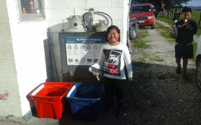 Tamariki get involved in recycling at Oturu Marae in Kaitaia.