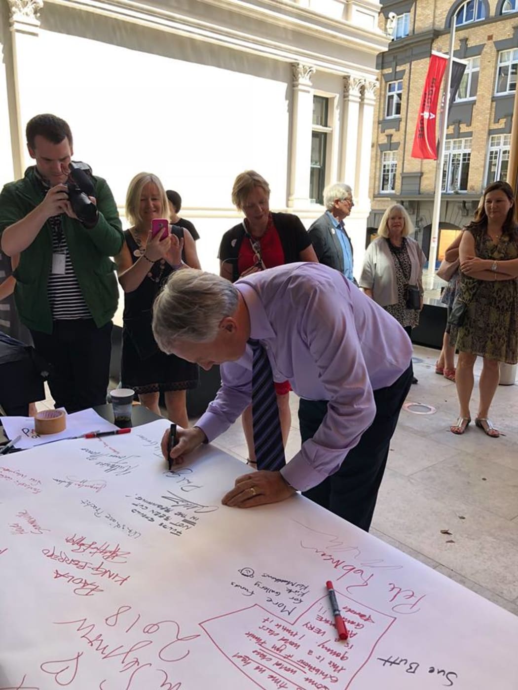 Auckland Mayor Phil Goff signing the Auckland Art Gallery Scroll