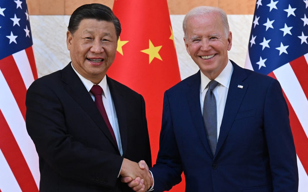 US President Joe Biden and China's President Xi Jinping shake hands as they meet on the sidelines of the G20 Summit in Nusa Dua on the Indonesian resort island of Bali on 14 November, 2022.
