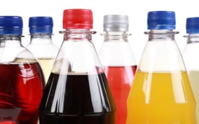 Bottles of soft drinks, isolated on a white background. (file photo)