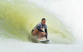 New Zealand surfer Paige Hareb sits in a tube during the inaugural Founders Cup.