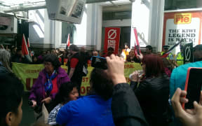 Protesters block the entrance of McDonald's on Queen Street