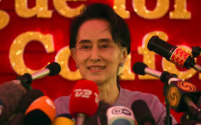 Myanmar opposition leader Aung San Suu Kyi and head of the National League for Democracy (NLD) speaks at a press conference from her residential compound in Yangon