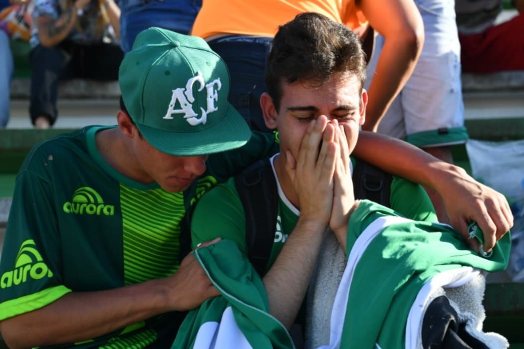 People pay tribute to the players of Brazilian team Chapecoense Real killed in a plane crash in the Colombian mountains on 29 November (NZT).